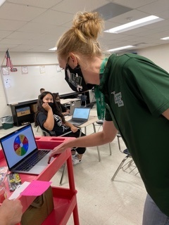 Coach Decamp spinning the prize wheel